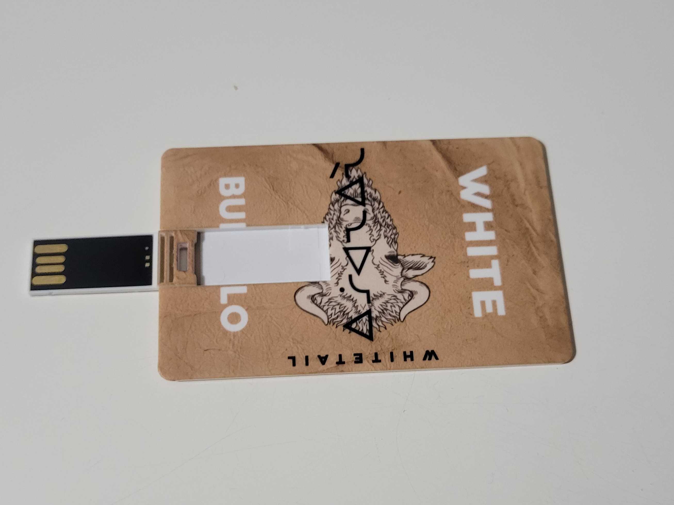 The same tan coloured card as the first image, this time with a USB card flipped out on the left side.